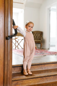 Knit Pink Overalls With White Blouse