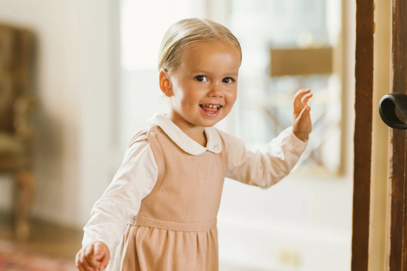 Knit Pink Overalls With White Blouse